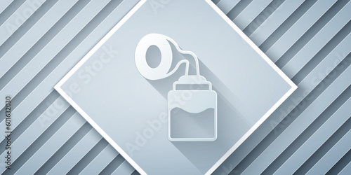 Paper cut Breast pump icon isolated on grey background. Paper art style. Vector