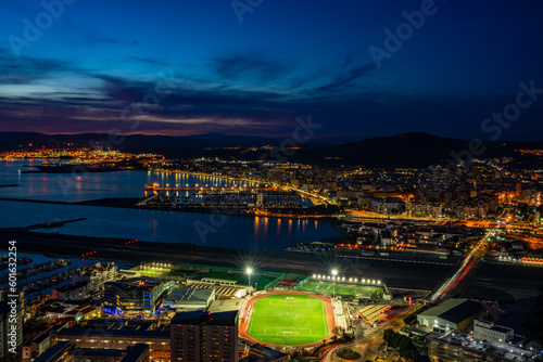 Sunset over Gibraltar town and  and Spanish town of La Linea de la Concepcion across the Bay of Gibraltar, UK © beataaldridge