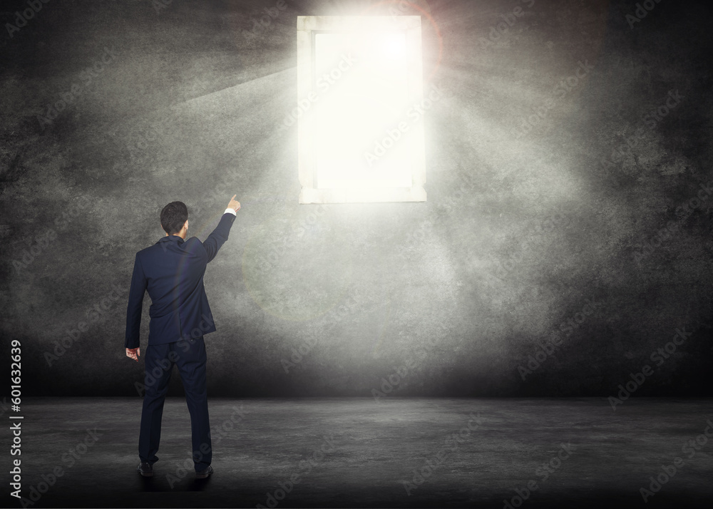 Back, opportunity and a business man with window light for access on a dark background with mockup. Wall, career and male professional and CEO pointing the way to future growth, success or leadership Back, opportunity and a business man with window light for access on a dark background with mockup. Wall, career and male professional and CEO pointing the way to future growth, success or leadership