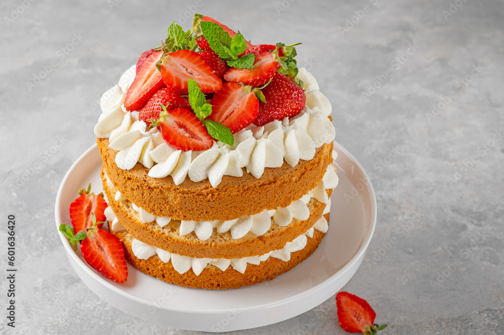 Strawberry cake, vanilla sponge cake with cream cheese and fresh strawberries. Summer cake. Selective focus. Strawberry cake, vanilla sponge cake with cream cheese and fresh strawberries. Summer cake. Selective focus.