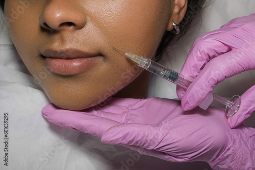 Young Woman Receiving Botox Injection In Beauty Clinic