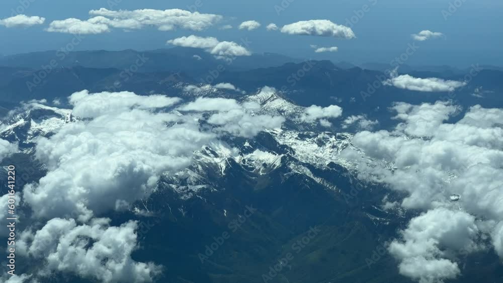 Aerial view of the snowed Alps shot during cruise from an airplane’s cabin. Pilot’s perspective Aerial view of the snowed Alps shot during cruise from an airplane’s cabin. Pilot’s perspective