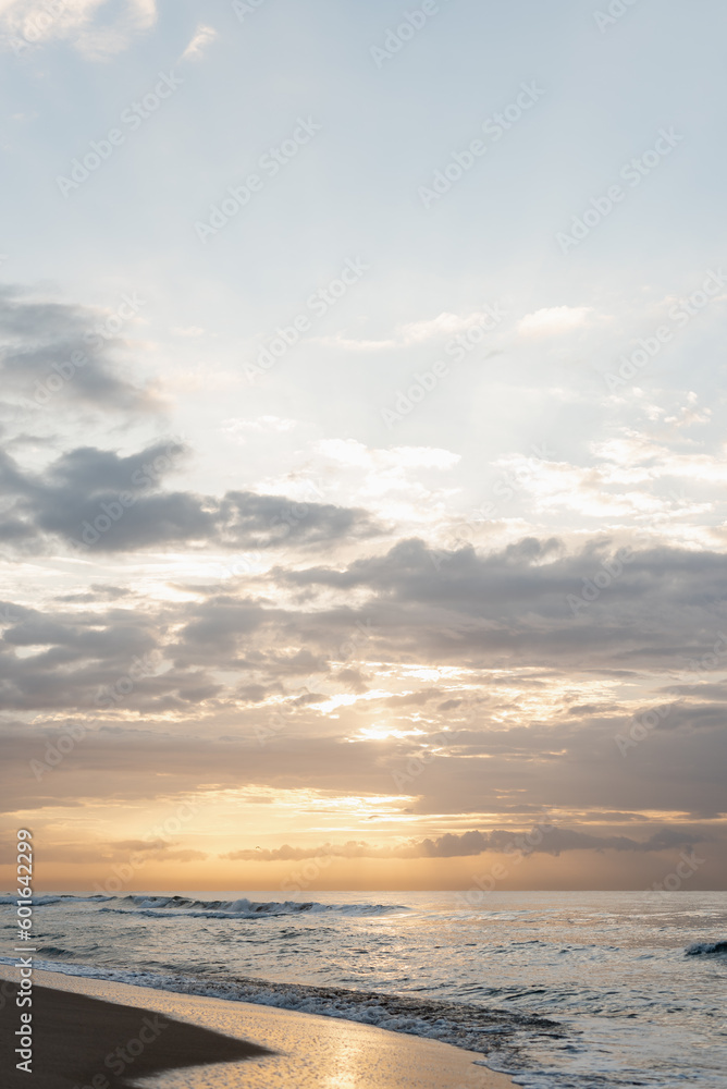 Background image of sea waves at sunset, sunrise time.