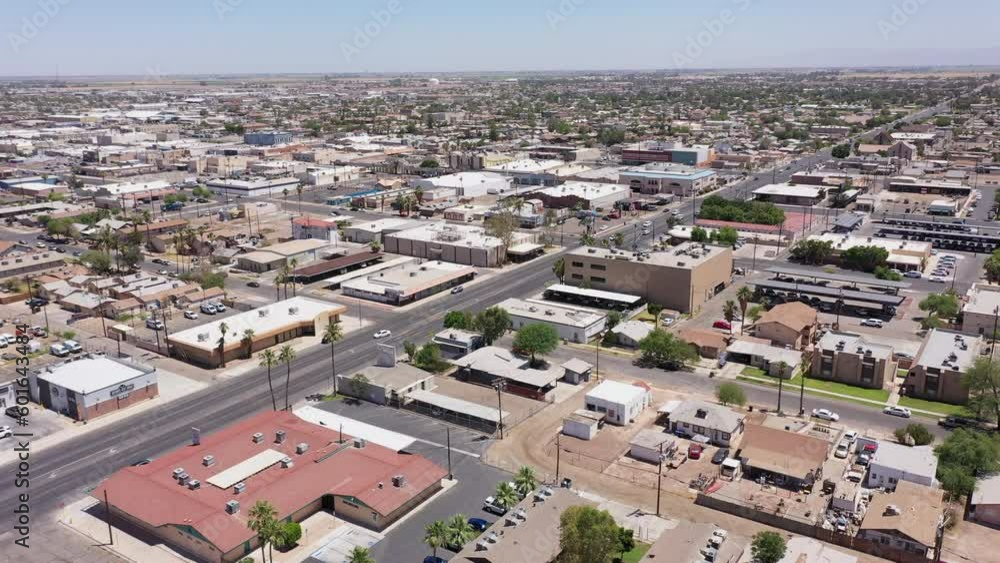 El Centro, California, USA - May 27, 2022: Afternoon sunlight shines on the urban downtown core of El Centro. El Centro, California, USA - May 27, 2022: Afternoon sunlight shines on the urban downtown core of El Centro.