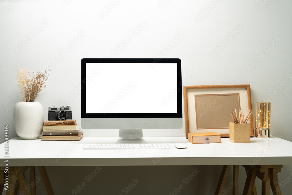 Bank screen of desktop computer on desk at workplace of graphic designer, blogger. Empty display for montage your graphic display Bank screen of desktop computer on desk at workplace of graphic designer, blogger. Empty display for montage your graphic display