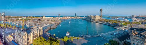  Panoramic aerial view of the port of Barcelona, Port Vell from the top of Columbus Monument at sunset photo