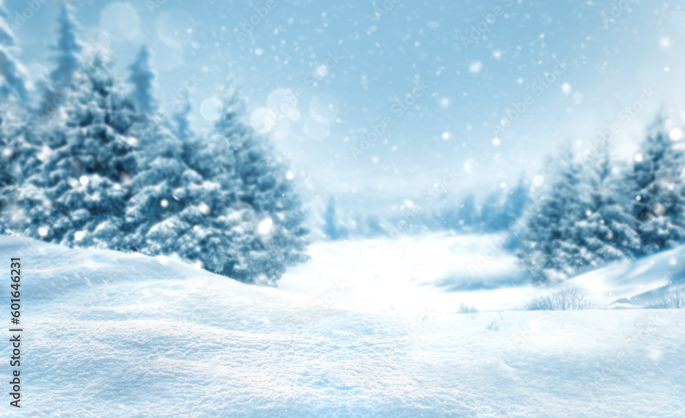 Christmas snowy landscape background with snow drifts hills and snow-covered blurred forest