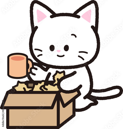 荷物を段ボールから取り出す白猫