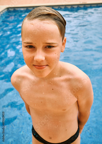 Smiling boy portrait, Child swim in the pool, sunbathes, swimming in hot summer day. Relax, Travel, Holidays, Freedom concept.