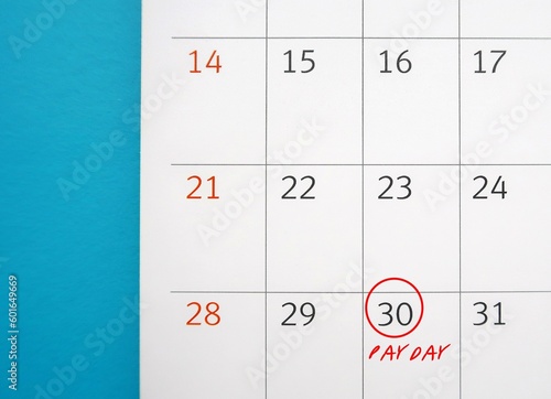 Calendar on blue background with circle on date 30 with text PAYDAY, a day on which someone is paid or expects to be paid their wages