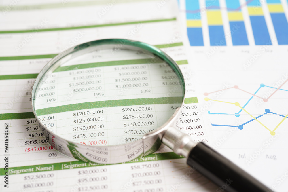 Magnifying glass on charts graphs paper. Financial development, Banking Account, Statistics, Investment Analytic research data economy. Magnifying glass on charts graphs paper. Financial development, Banking Account, Statistics, Investment Analytic research data economy.