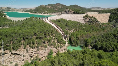 Drone clip showing the large El Chorro hydroelectric dam surrounded by forested hills and rocky cliffs
