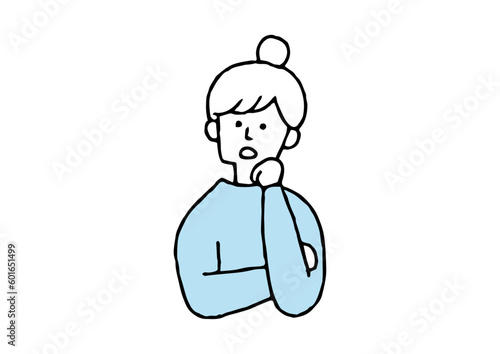 首をかしげる女性