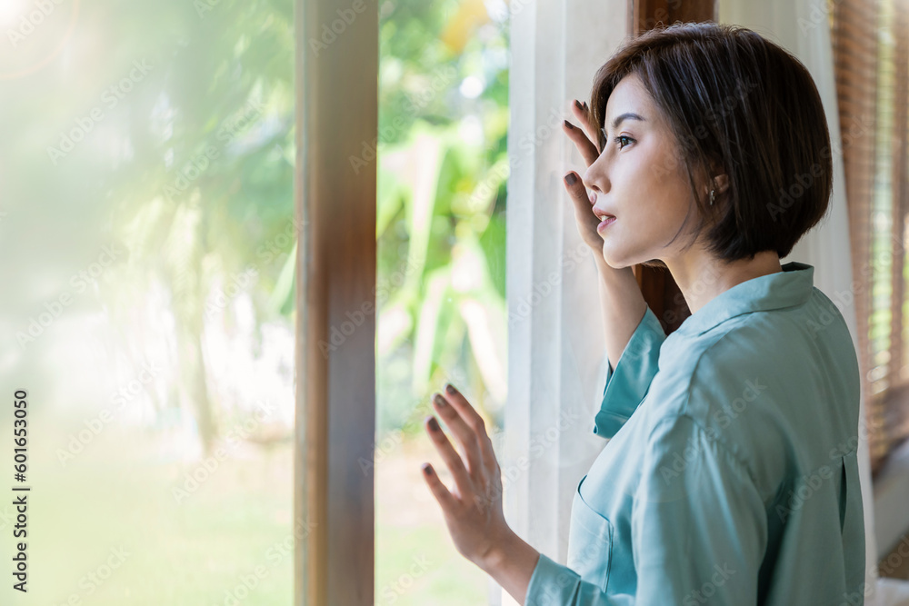 Portrait of beautiful asian woman feeling depress stress looking. Sad face asian girl stand near window in spring Beauty treatment perfect clear skin, japanese korean makeup, lifestyle concept
