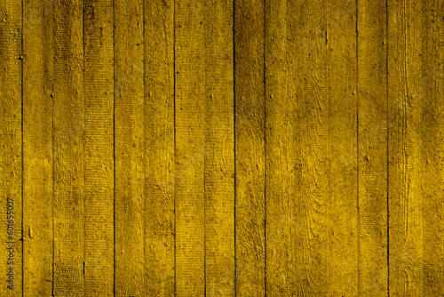 Yellow wooden imprint from formwork in concrete wall for background