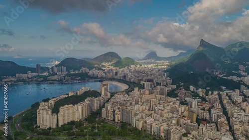 RIO DE JANEIRO, BRASIL - MAY, 2023: Drone aerial timelapse view of of Botafogo beach and district on Guanabara Bay. Modern and historical buildings on the shore on background at sunny day from above. photo