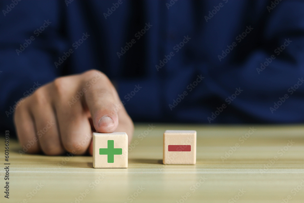 Wooden blocks showing plus and minus signs. The concept of antithesis. Decision making. Positive or negative business choice. Analysis of advantages and disadvantages Comparison	 - obrazy, fototapety, plakaty 