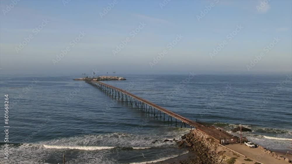 Aerial cinematic drone Recon Island morning stunning surf Santa Barbara Isla Vista California Ocean bay pier xgames spring green yellow blues gold down movement Aerial cinematic drone Recon Island morning stunning surf Santa Barbara Isla Vista California Ocean bay pier xgames spring green yellow blues gold down movement