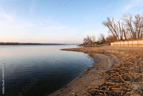 Fototapeta Naklejka Na Ścianę i Meble -  Zaporizhzhia, Ukraine - January 20th, 2023 - Abnormal drop in water level in the Dnieper River