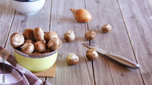 fresh brown champignons on the kitchen table