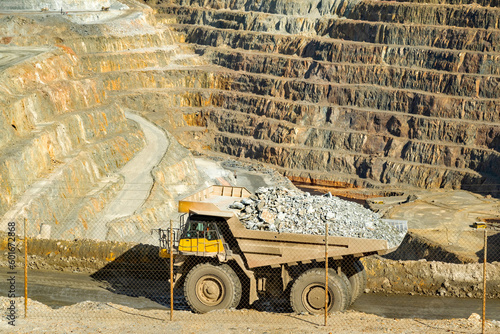 Loaded dump truck driving along Cerro colorado, the largest active open pit mine in Europa producing copper, silver and several other metal ores