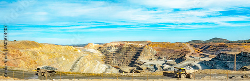 Dump trucks driving along Cerro colorado, the largest active open pit mine in Europa producing copper, silver and several other metal ores