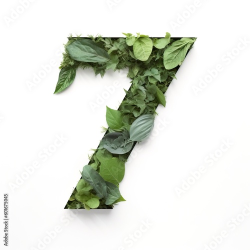 Minimalist Collage of Number 7 Made with Leaf Cutouts on White Background photo