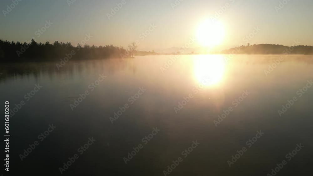 Aerial view of foggy lake surface and sunrise time Aerial view of foggy lake surface and sunrise time