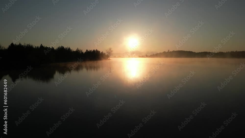 Aerial view of foggy lake surface and sunrise time Aerial view of foggy lake surface and sunrise time