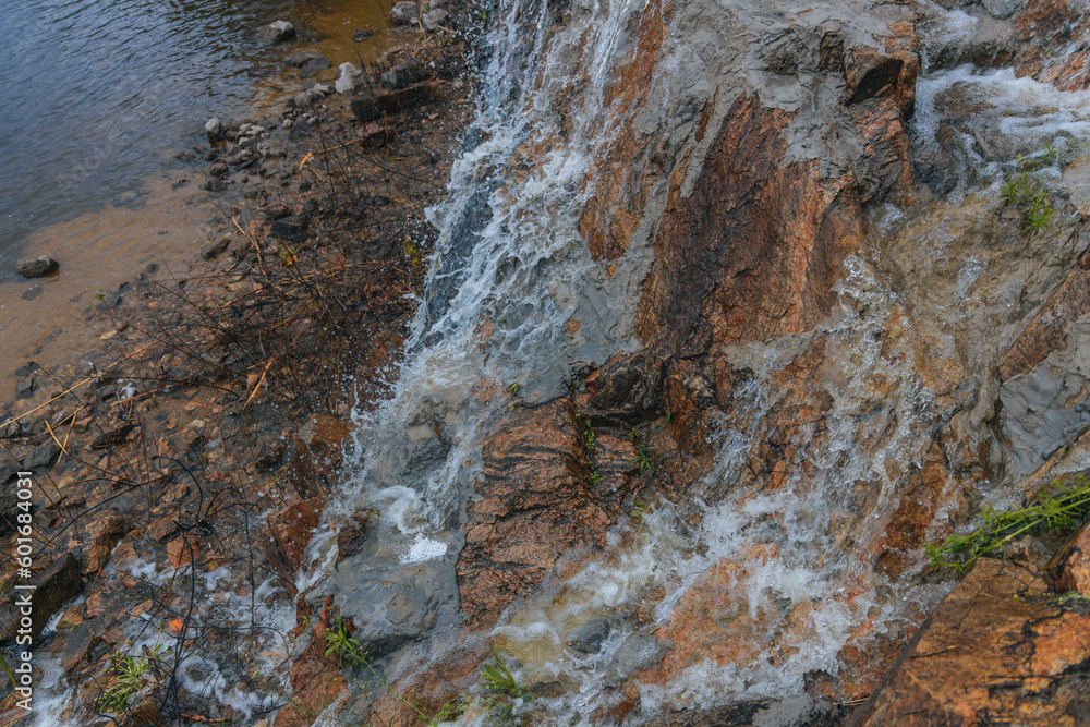 Waterfall Loud threshold on the slope of the Monastery Island in the Dnieper, Ukraine. Artificial decorative waterfall. Waterfall Loud threshold on the slope of the Monastery Island in the Dnieper, Ukraine. Artificial decorative waterfall.