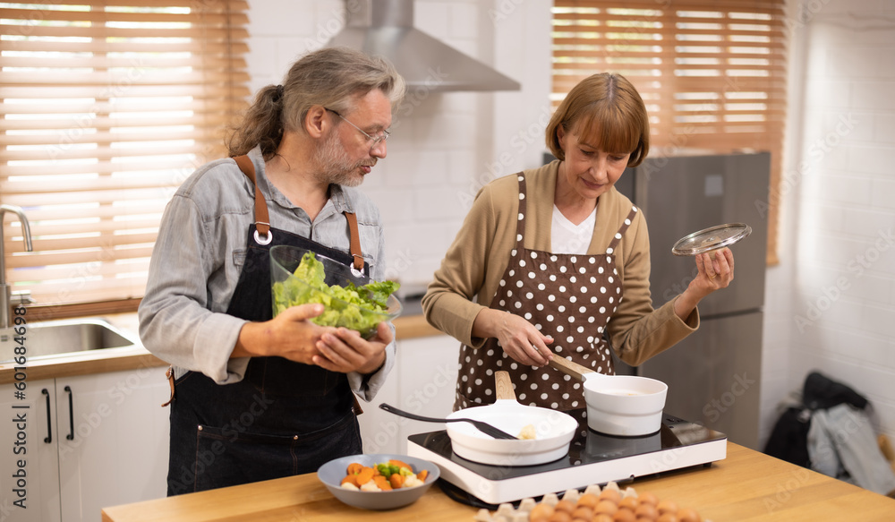 Couples in their golden years cook together. Deep talk can bring back vivid memories and romantic times. There is still a sense of fun, mutual understanding, commitment, support, and reliability.