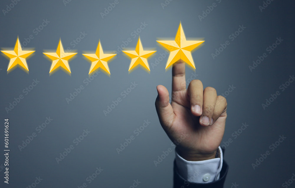 hand reach to touch the five star represnt to very good service quality evaluation. hand reach to touch the five star represnt to very good service quality evaluation.