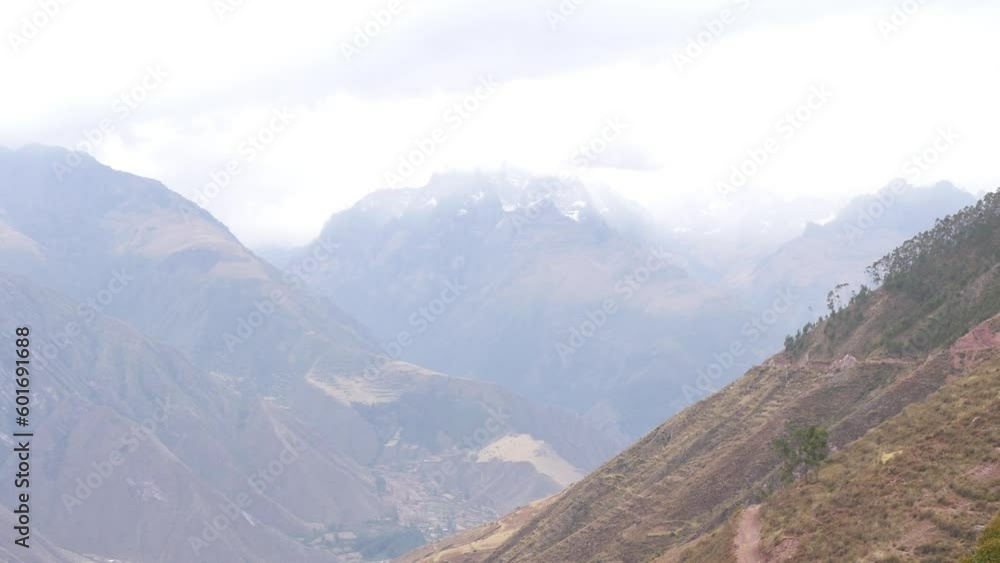 Panoramic view of the scenic landscape  in the Andes Mountains of Peru with clouds in the background. Handheld Shot.