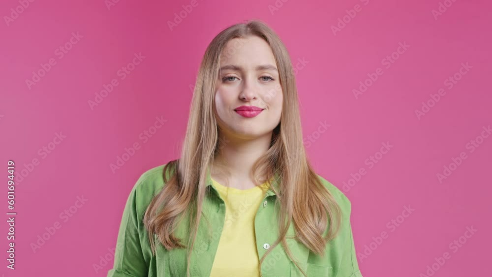 Smiling blonde woman disapproving, no head signal, nods head disapprovingly Smiling blonde woman disapproving, no head signal, nods head disapprovingly
