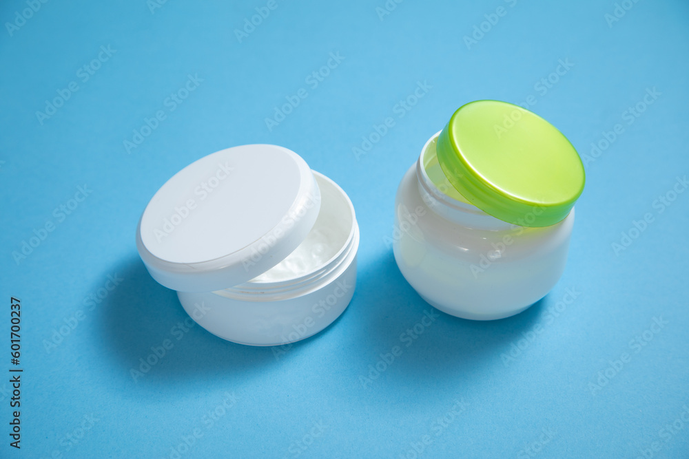 Cream jar on the blue background. Cream jar on the blue background.