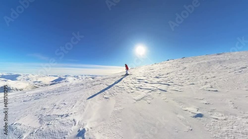 Stunning fast shot of skiers skiing downhill Norway mountain in Myrkdalen - Action filled of male and female offpiste skiers photo