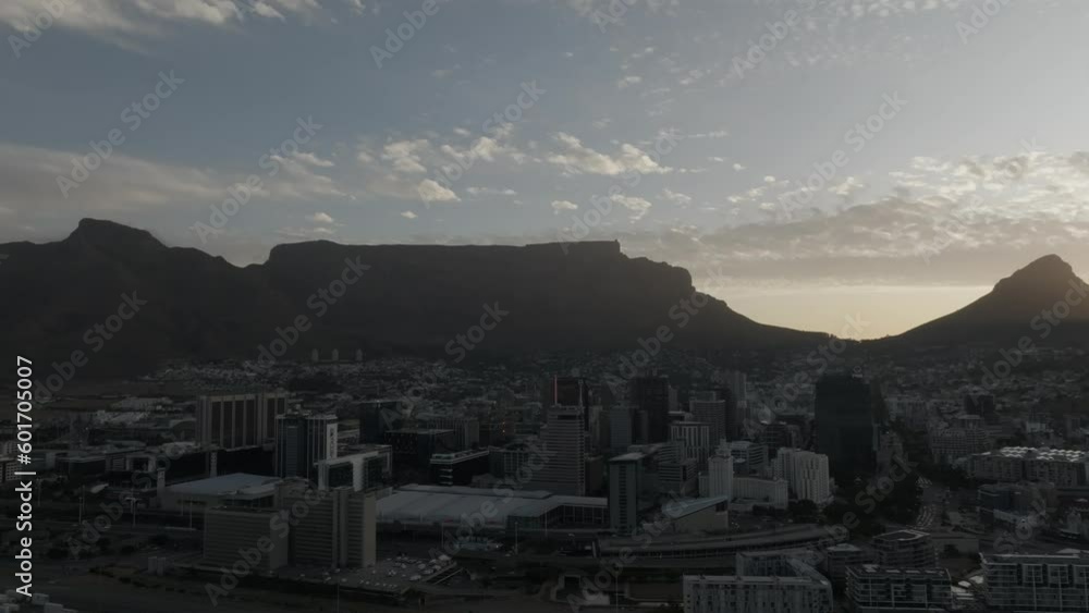 4K Cape Town cityscape during sunset, golden hour last light, flying towards city. Wide shot, beautiful clouds with Table Mountain in the background. 4K Cape Town cityscape during sunset, golden hour last light, flying towards city. Wide shot, beautiful clouds with Table Mountain in the background.