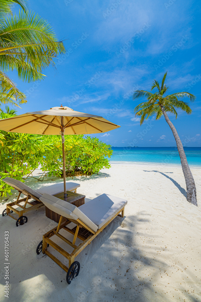 Beautiful island beach. Couple chairs on sandy beach, sunny sea sky palms. Summer holiday, vacation destination concept. Inspire tropical nature landscape. Tranquil relaxing beach exotic luxury scenic