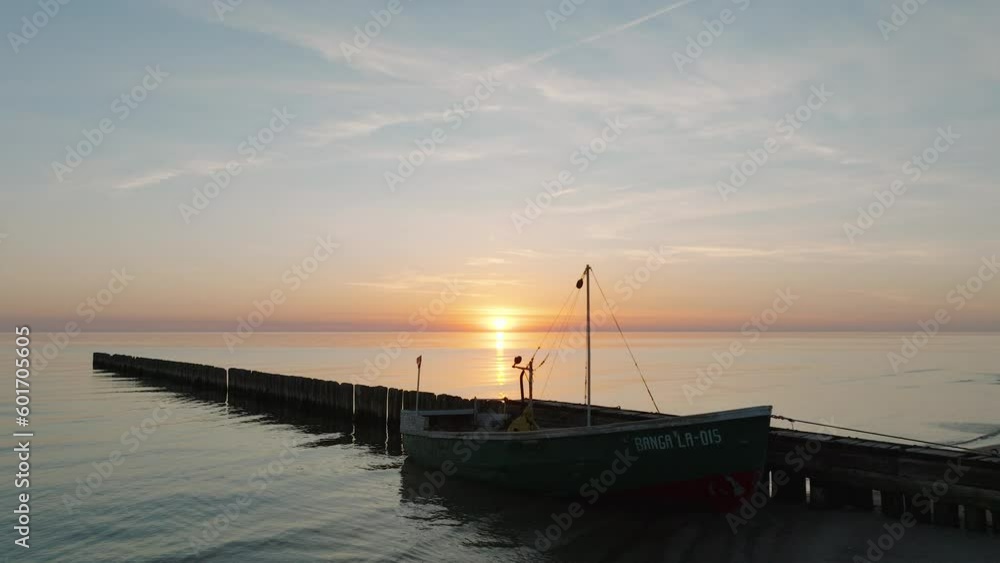 Establishing aerial view of Baltic sea coast, old wooden pier, calm evening with vibrant sunset, romantic golden hour light, white sand beach, wide drone shot moving forward low Establishing aerial view of Baltic sea coast, old wooden pier, calm evening with vibrant sunset, romantic golden hour light, white sand beach, wide drone shot moving forward low