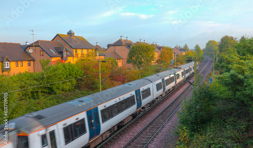 London commuter train in motion - Located on West Anglia Main Line serving the small town of Sawbridgeworth in Hertfordshire, England