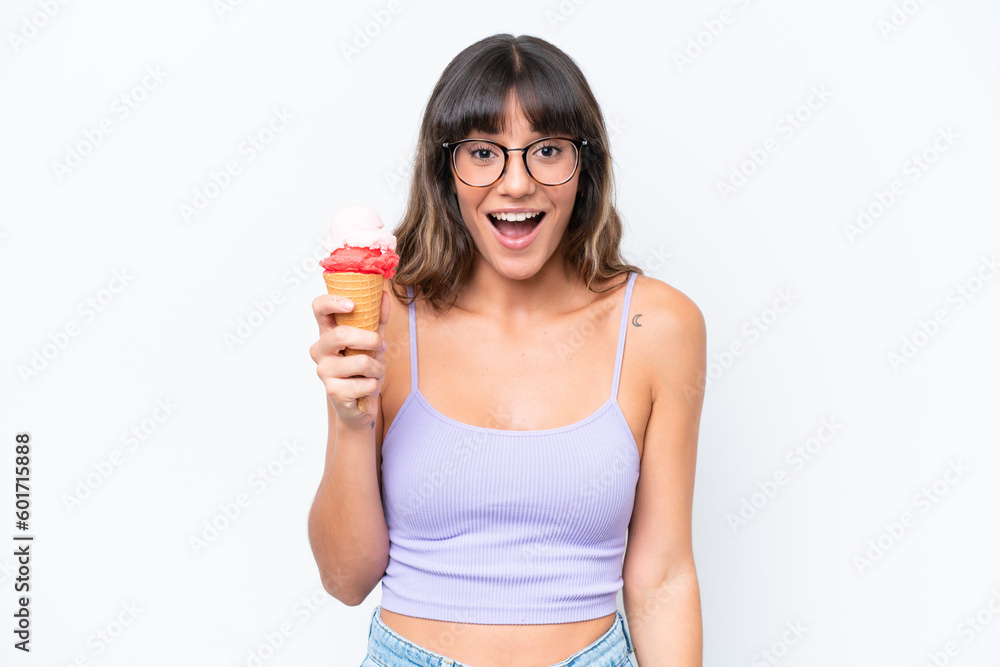 Young caucasian woman with a cornet ice cream over isolated white background with surprise facial expression Young caucasian woman with a cornet ice cream over isolated white background with surprise facial expression