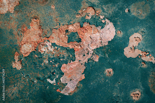 rusting old metal plate painted with green paint