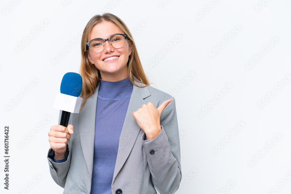 Young TV presenter caucasian woman isolated on white background pointing to the side to present a product Young TV presenter caucasian woman isolated on white background pointing to the side to present a product