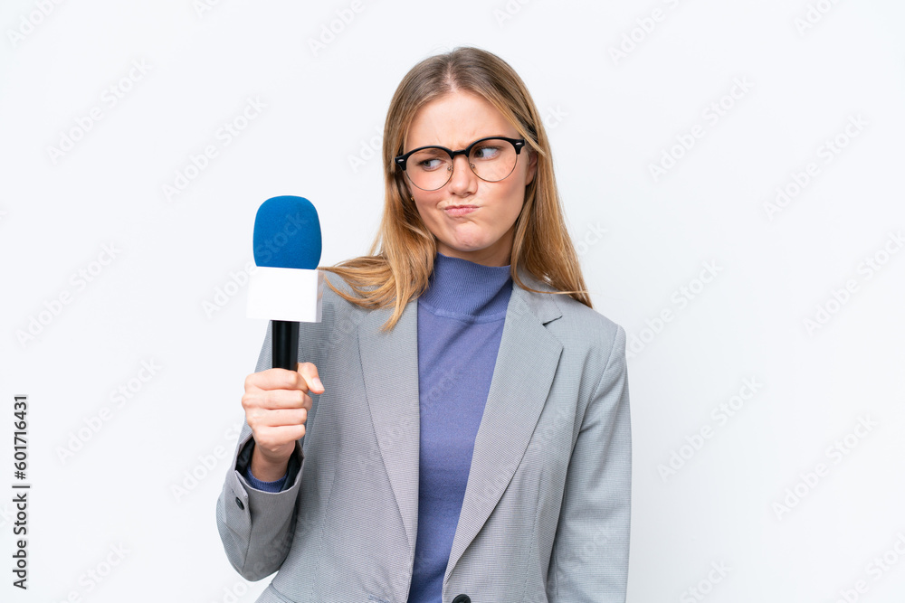 Young TV presenter caucasian woman isolated on white background with sad expression Young TV presenter caucasian woman isolated on white background with sad expression