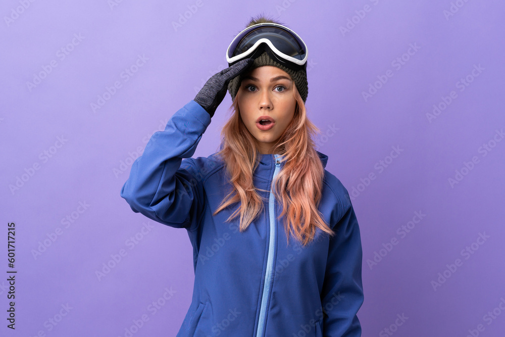 Skier teenager girl with snowboarding glasses over isolated purple background has realized something and intending the solution
