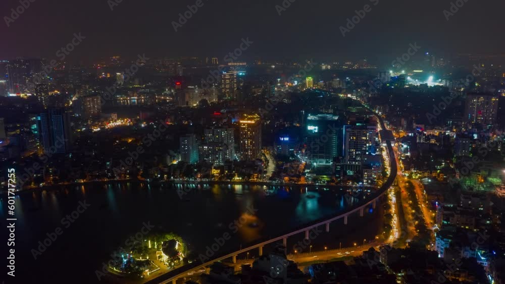 HANOI, VIETNAM - MAY, 2023: Night aerial drone view timelapse of a city streets in downtown nightlife traffic from a top view. HANOI, VIETNAM - MAY, 2023: Night aerial drone view timelapse of a city streets in downtown nightlife traffic from a top view.
