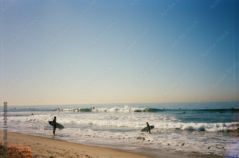 surfers on the beach