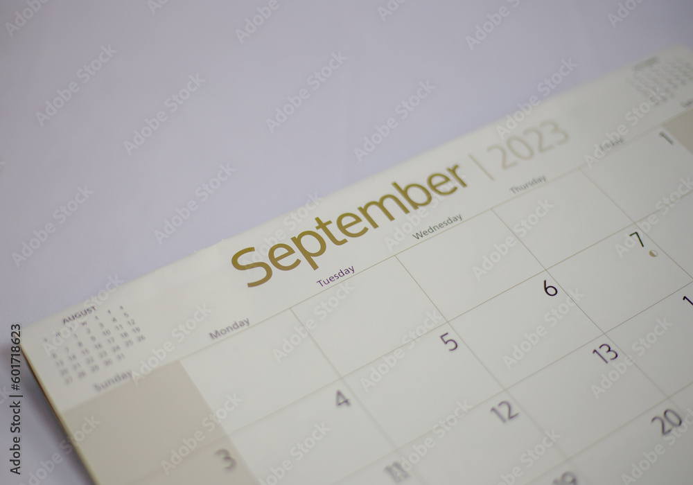 Selective focus shot of a closeup calendar of September 2023. September 2023 calendar isolated on background. Selective focus shot of a closeup calendar of September 2023. September 2023 calendar isolated on background.