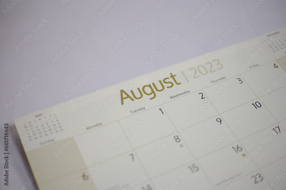 Top view of a closeup calendar of August 2023. Selective focus shot of a calendar on august page. Top view of a closeup calendar of August 2023. Selective focus shot of a calendar on august page.