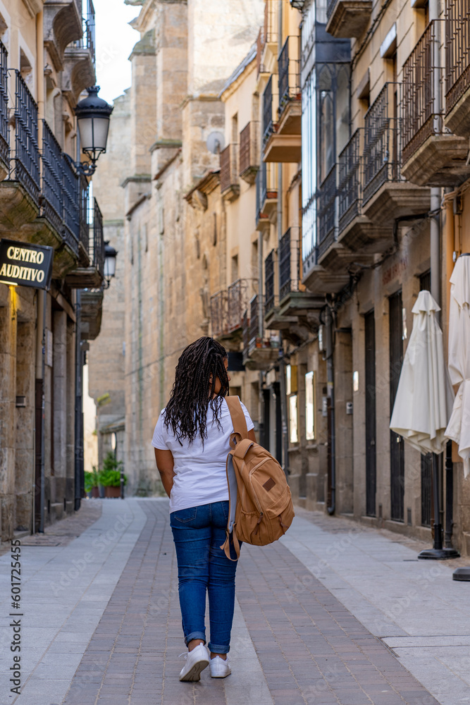 Tourist woman walking around Ciudad Rodrigo in Salamanca.